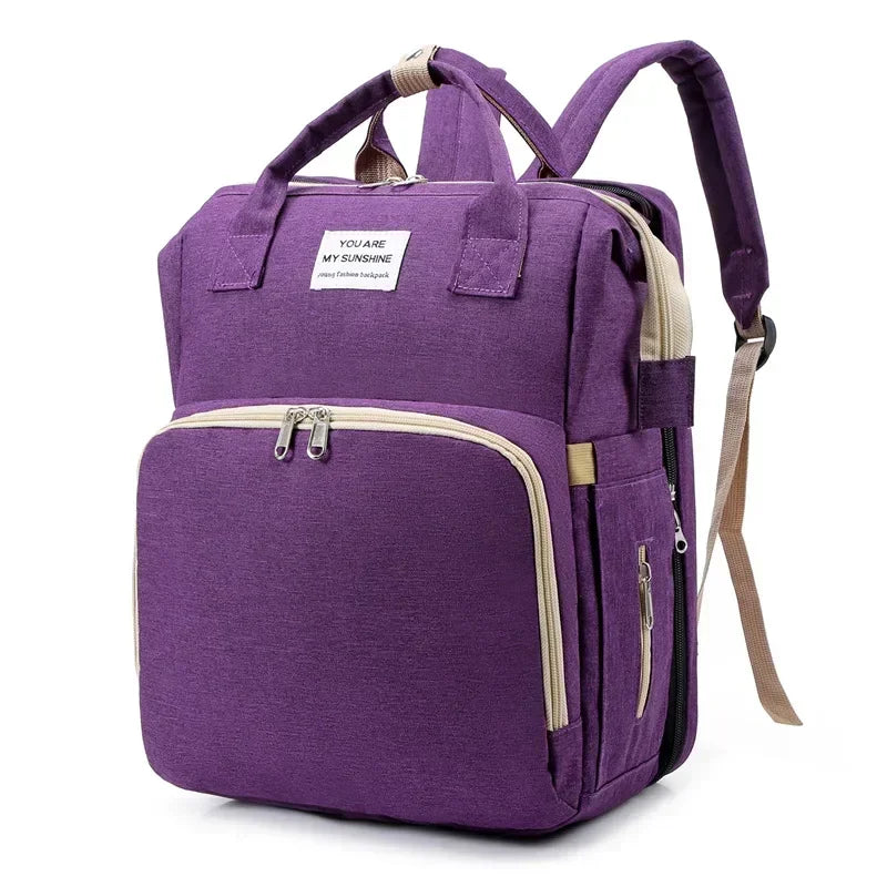 Mochila cambiador para bebé morada